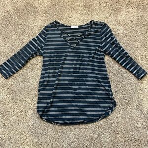 Blue and white shirt, V-neck size medium in woman’s